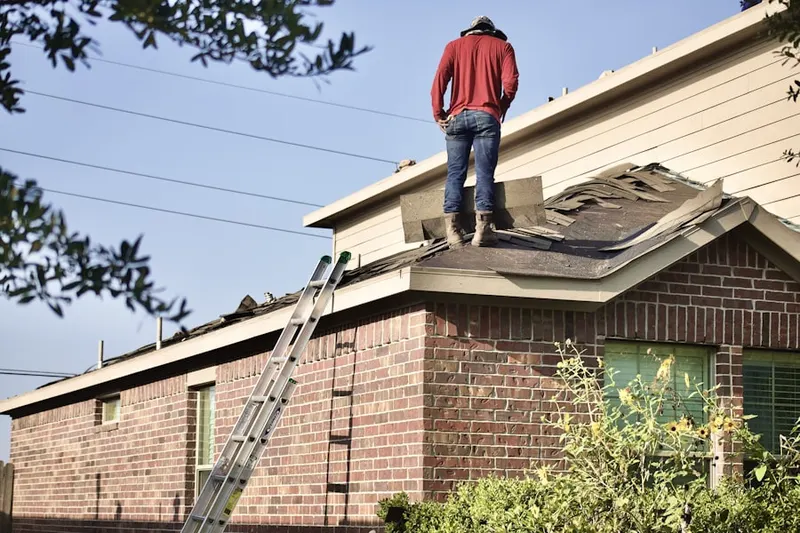 Professional roofer working on a residential roof in Brittany Farms at Equus